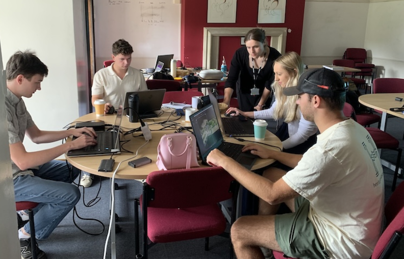 UWM Historic Buildings Institute students at Herstmonceux Castle meet to discuss findings
